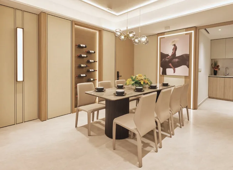 Coastal Cabana, artist&rsquo;s impression: a dining room with a six-seat table, pendant lights and a wine display, in the developer&rsquo;s show-unit styling