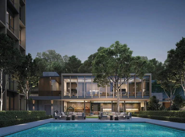 Coastal Cabana, artist&rsquo;s impression: the Gathering Lounge, a glass pavilion beside a pool at dusk, with a residential block behind