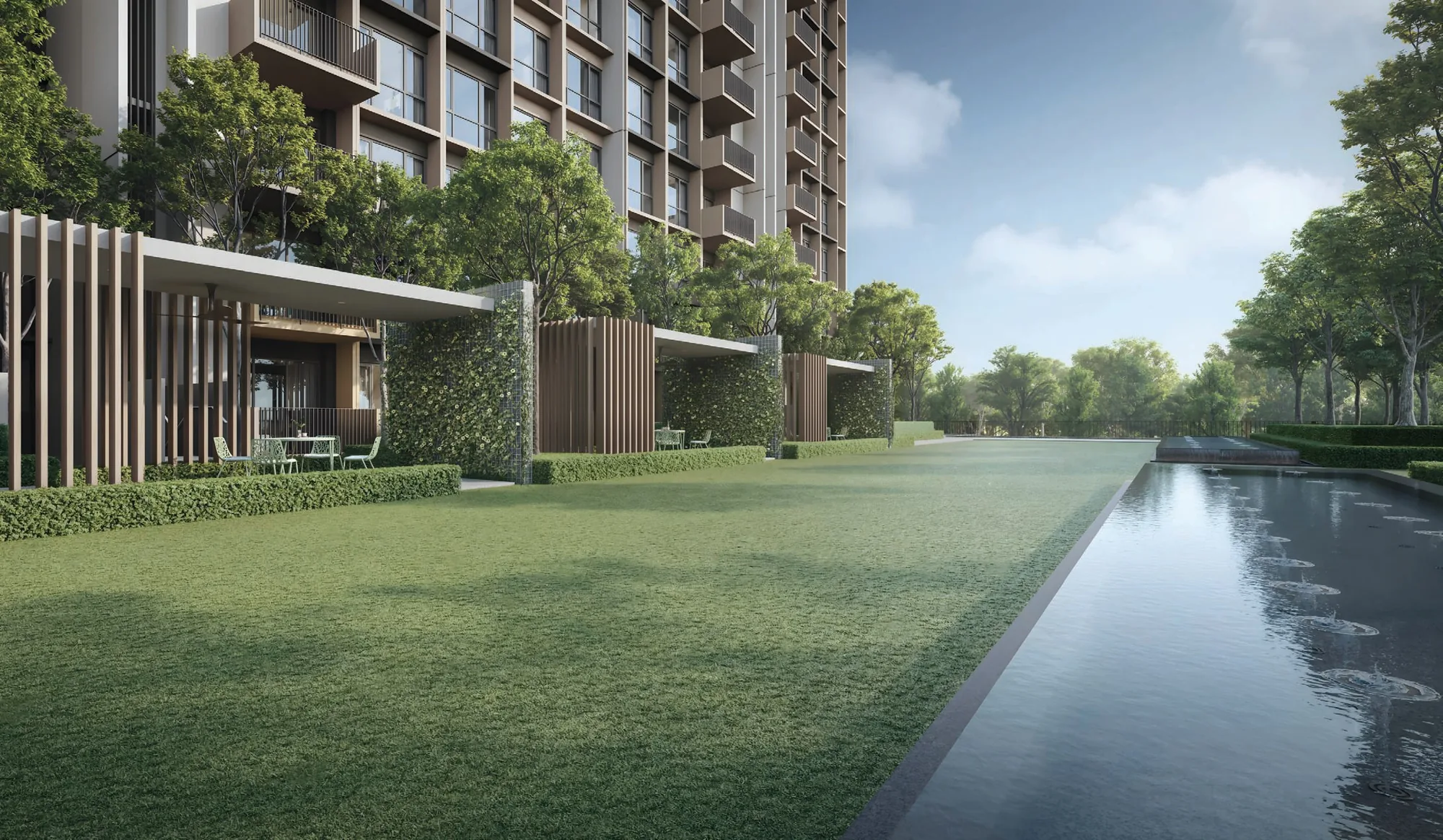 Coastal Cabana, artist&rsquo;s impression: the Meadow Lawn in the Lush Oasis, a wide lawn beside a long pool with a covered pavilion and the blocks behind